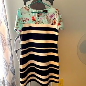 This is a cute Anthropologie dress. The top is silk and the bodice is stretchy.